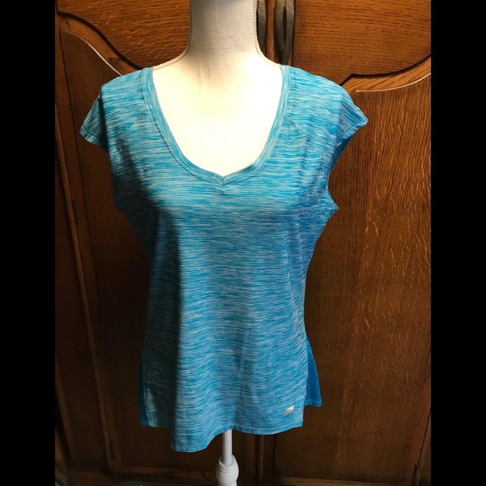 Marika sports top.